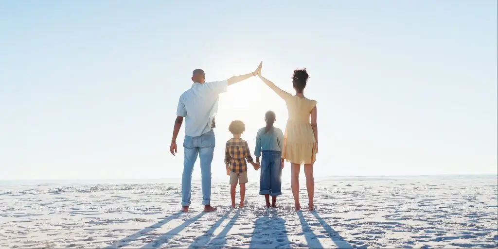 Back, high five or insurance with a family on the beach together for security, travel or vacation.