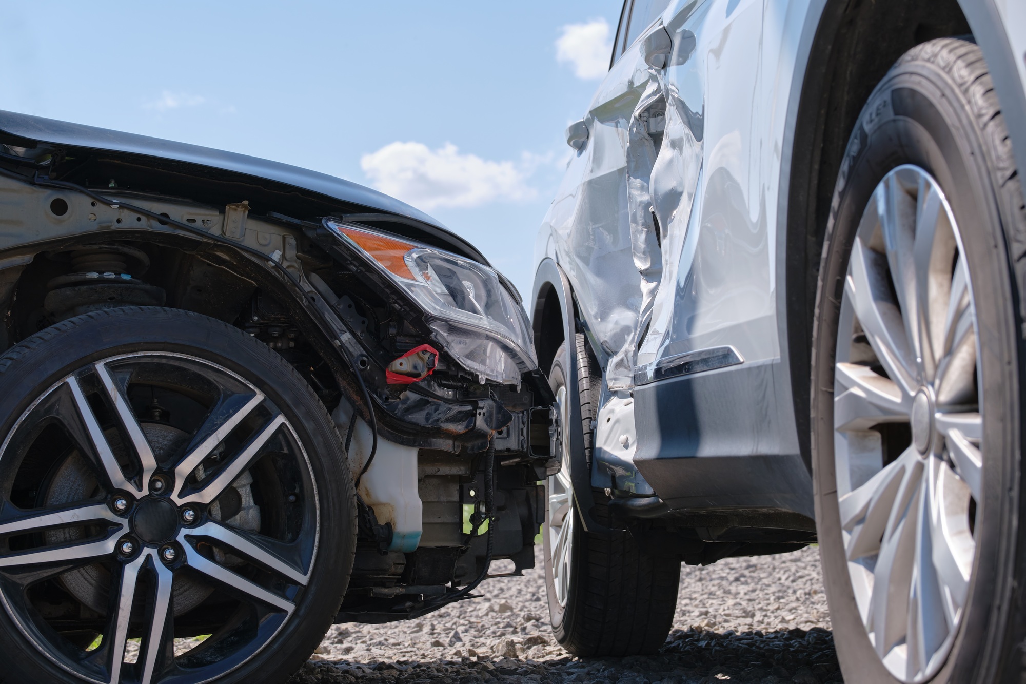 Cars crashed heavily in road accident after collision on city street. Road safety and insurance